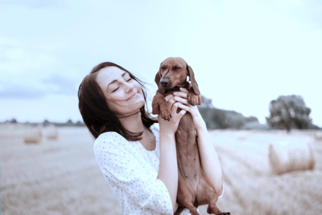 Lady carrying a dog