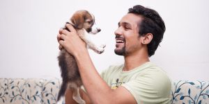 man with puppy